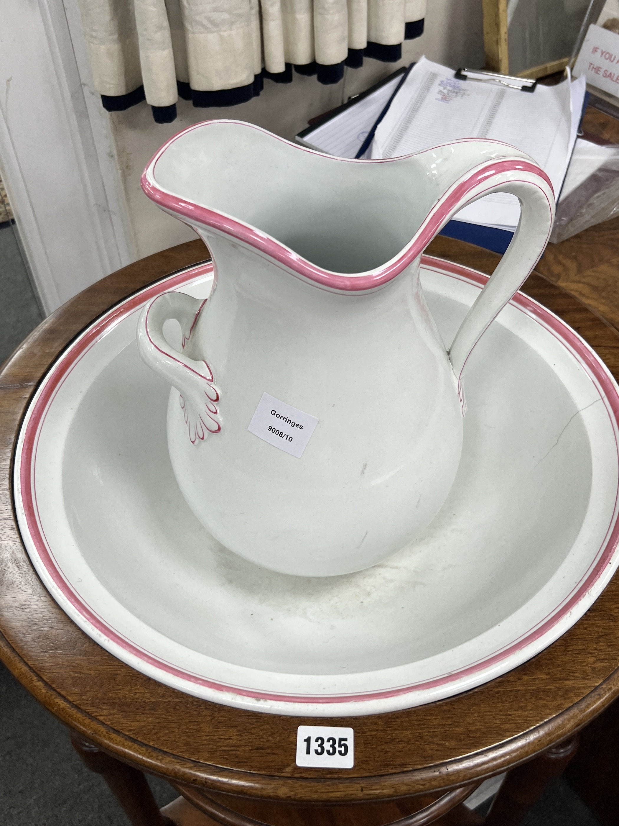 A Victorian circular mahogany three tier washstand with ceramic jug and basin, diameter 55cm, height 76cm